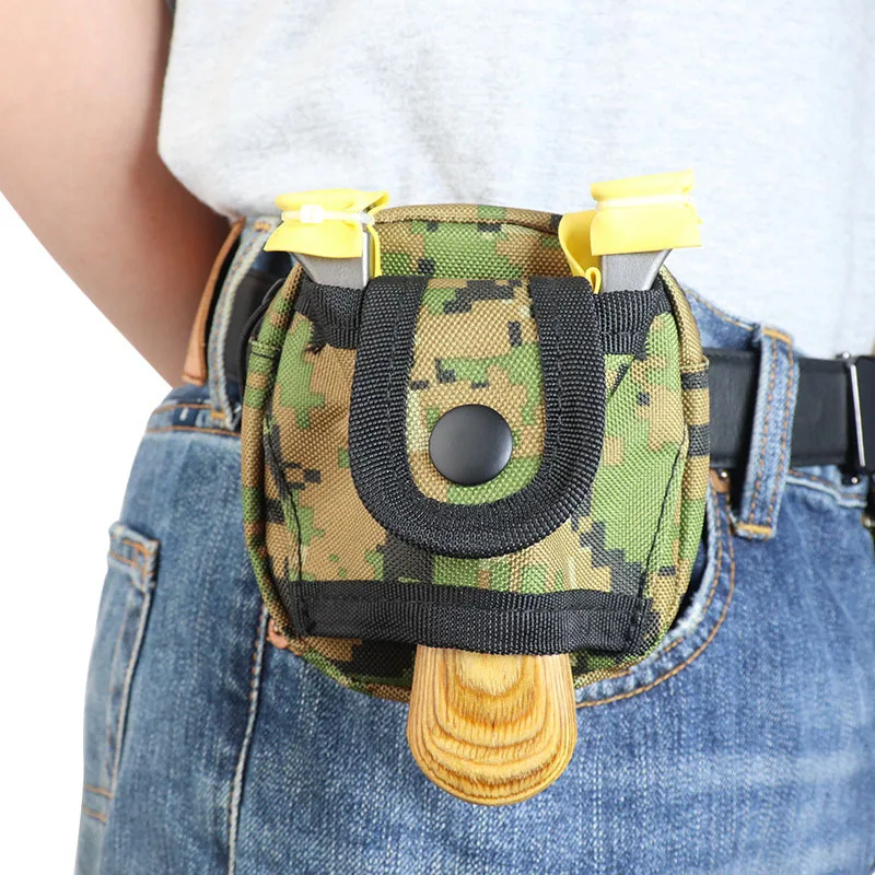 Compact camo pouch attached to a belt, featuring a front snap button closure and yellow clips, designed for convenient carrying of small items.