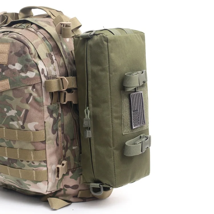 Camouflage backpack with an attached green modular pouch, featuring MOLLE webbing and secure buckle straps for additional storage.