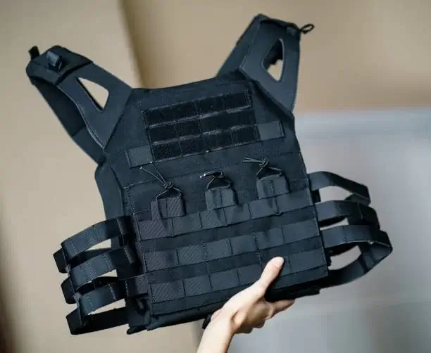 Body armor suit, Bulletproof vest for protection from bullets in the hand.