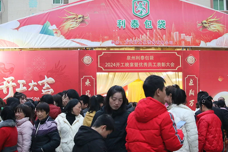 A large tent built on the vacant lot of the factory