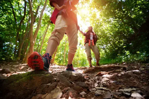 Two hikers with tactical backpacks