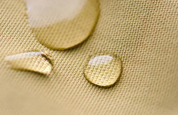 water drops beading pearling on waterproof nylon jacket.